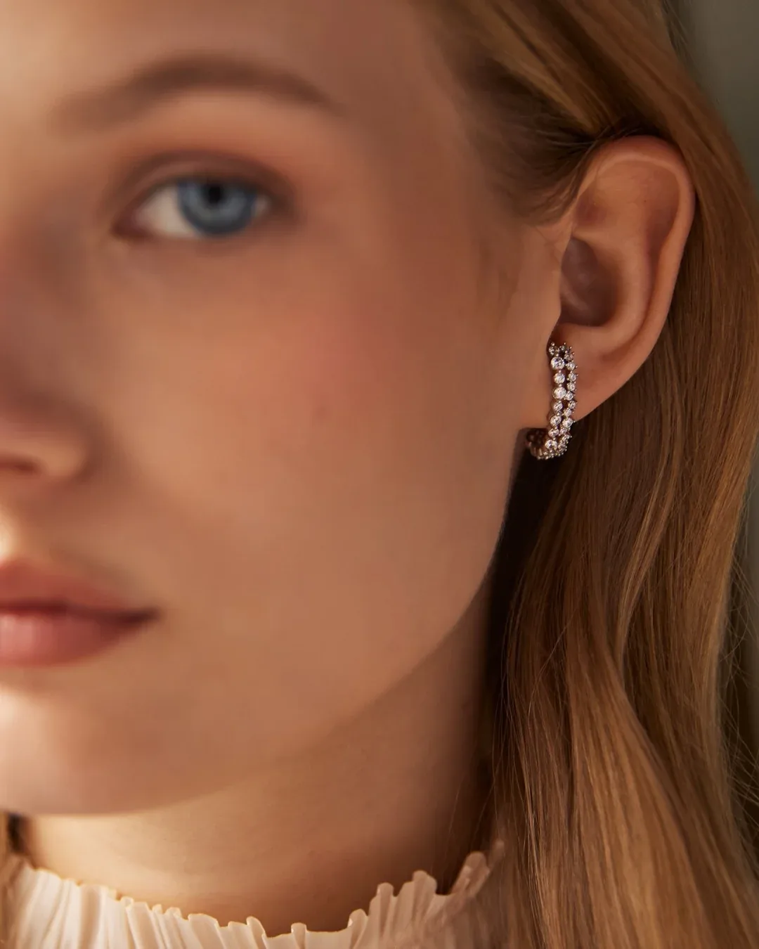 Gold plated curved crystal hoop earrings