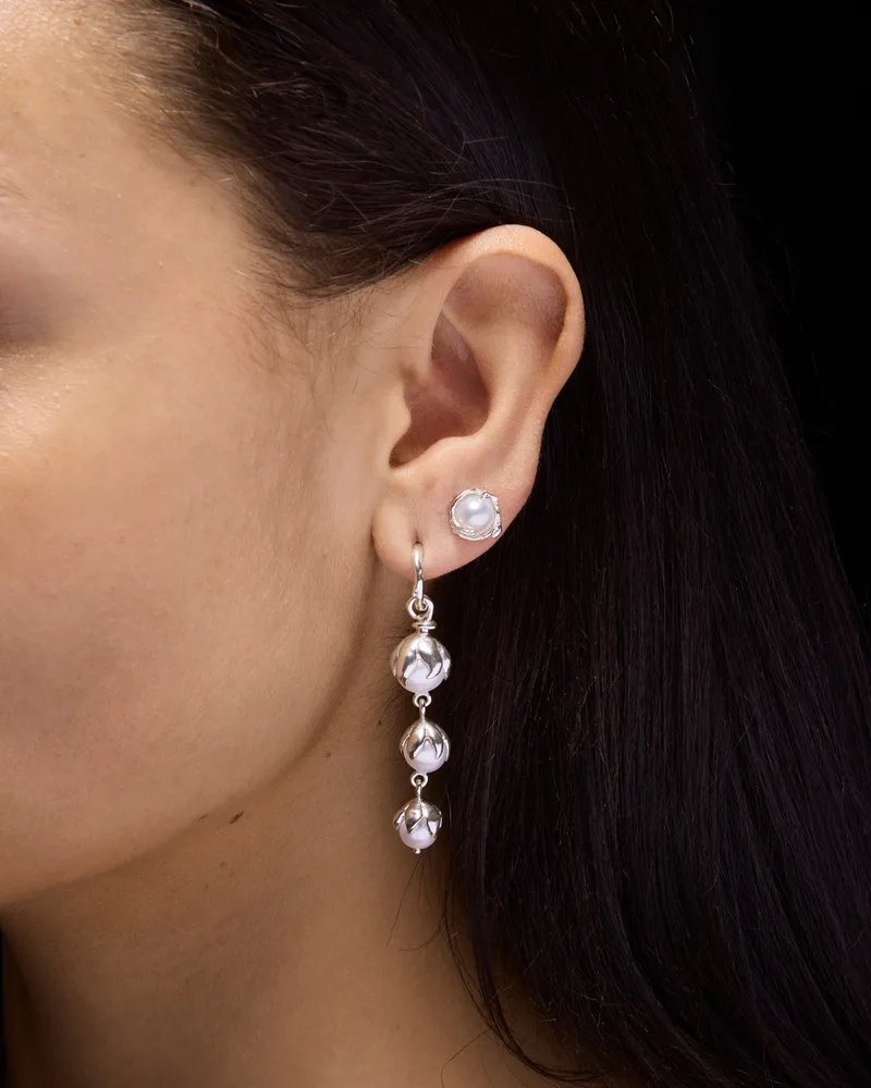 Sterling silver hoop earring with three freshwater pearl drops