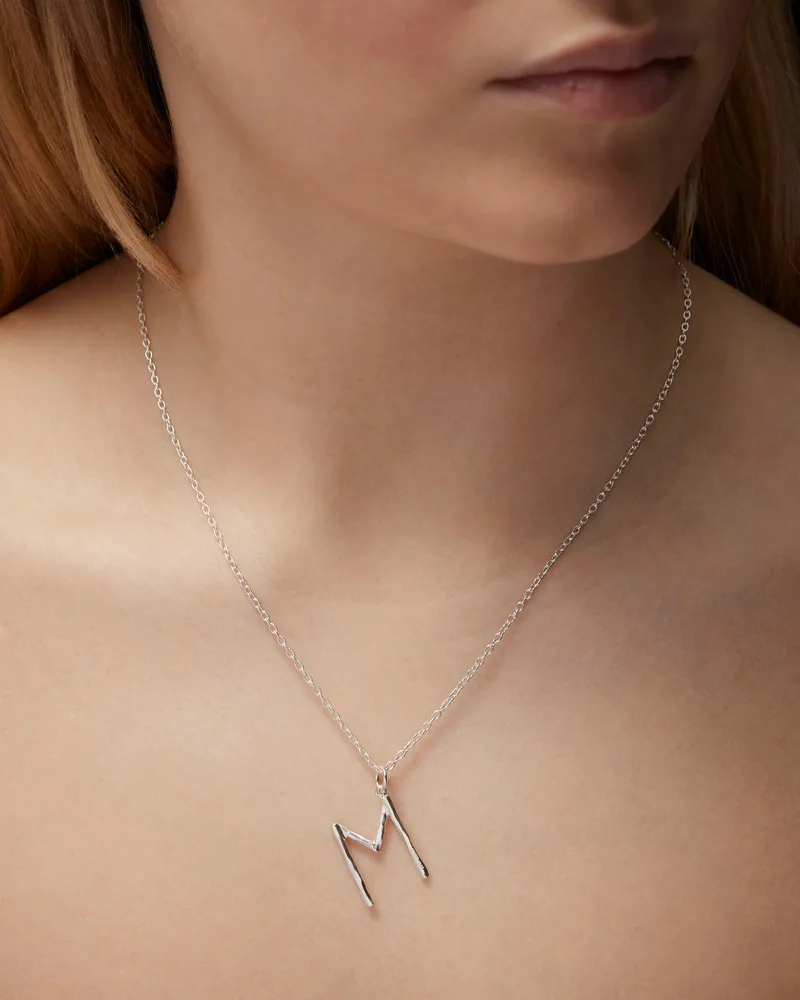 Sterling silver initial letter pendant on a fine chain