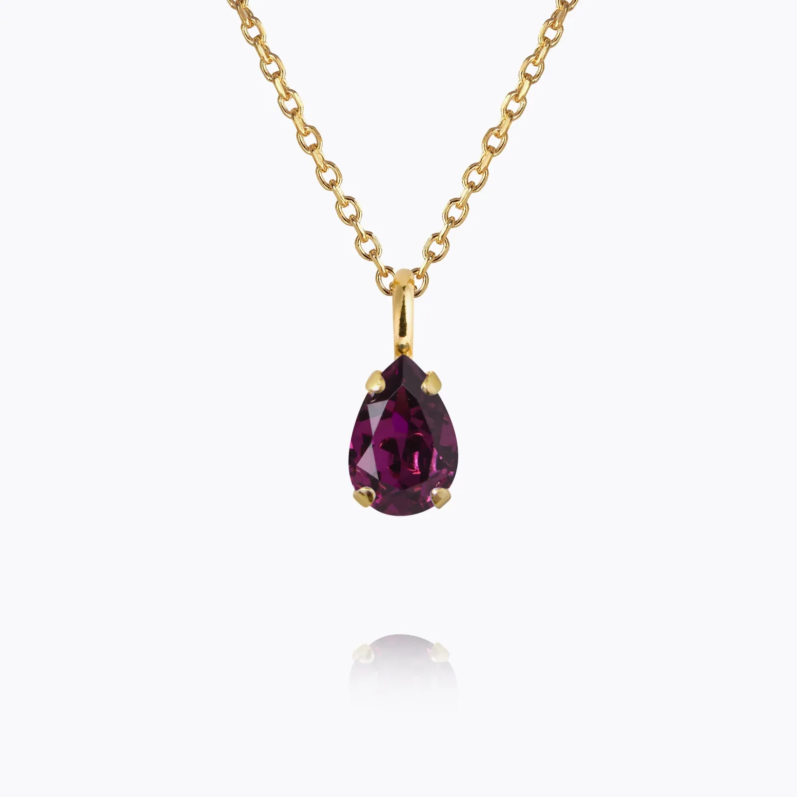 Gold necklace with a single birthstone crystal