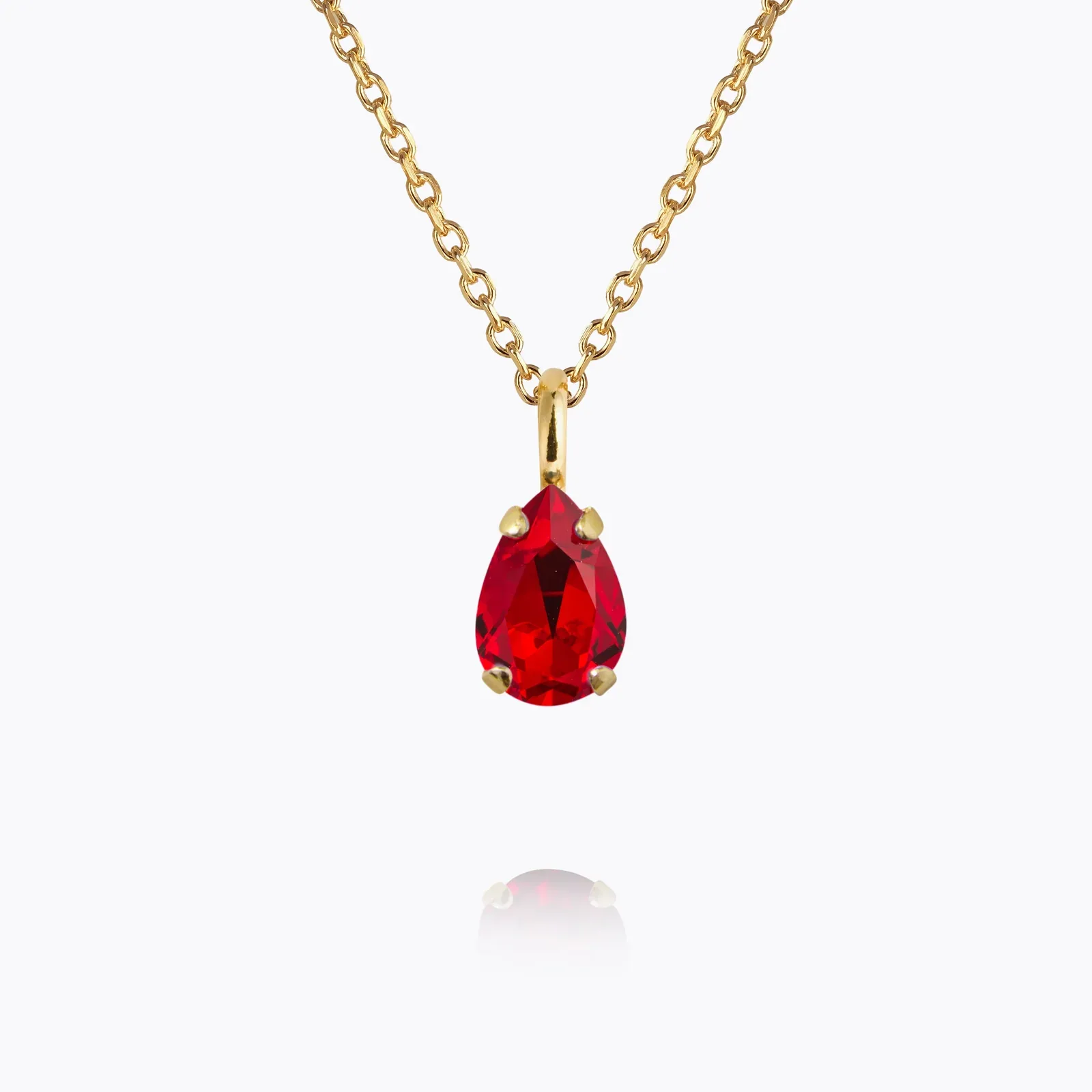 Gold necklace with a single birthstone crystal