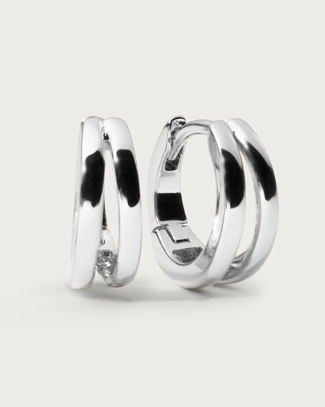 Twist Huggie Hoops in silver