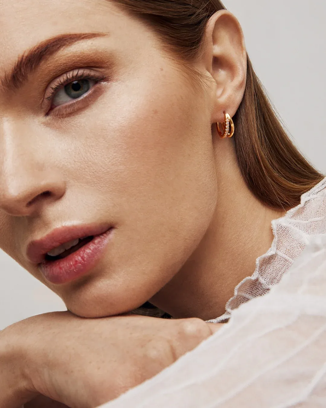 Gold plated crystal huggie hoop earrings