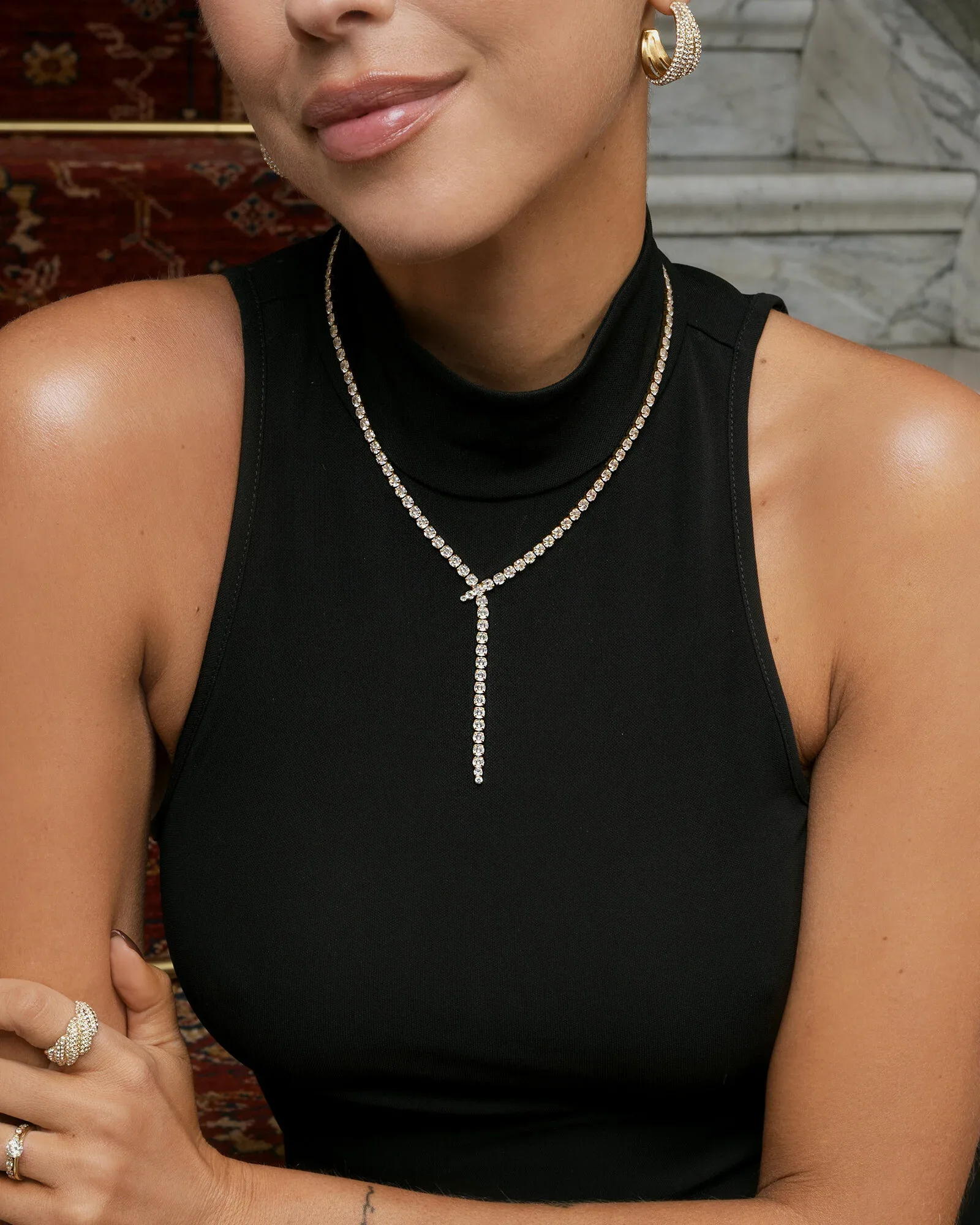 Gold plated steel lariat necklace set with cubic zirconia