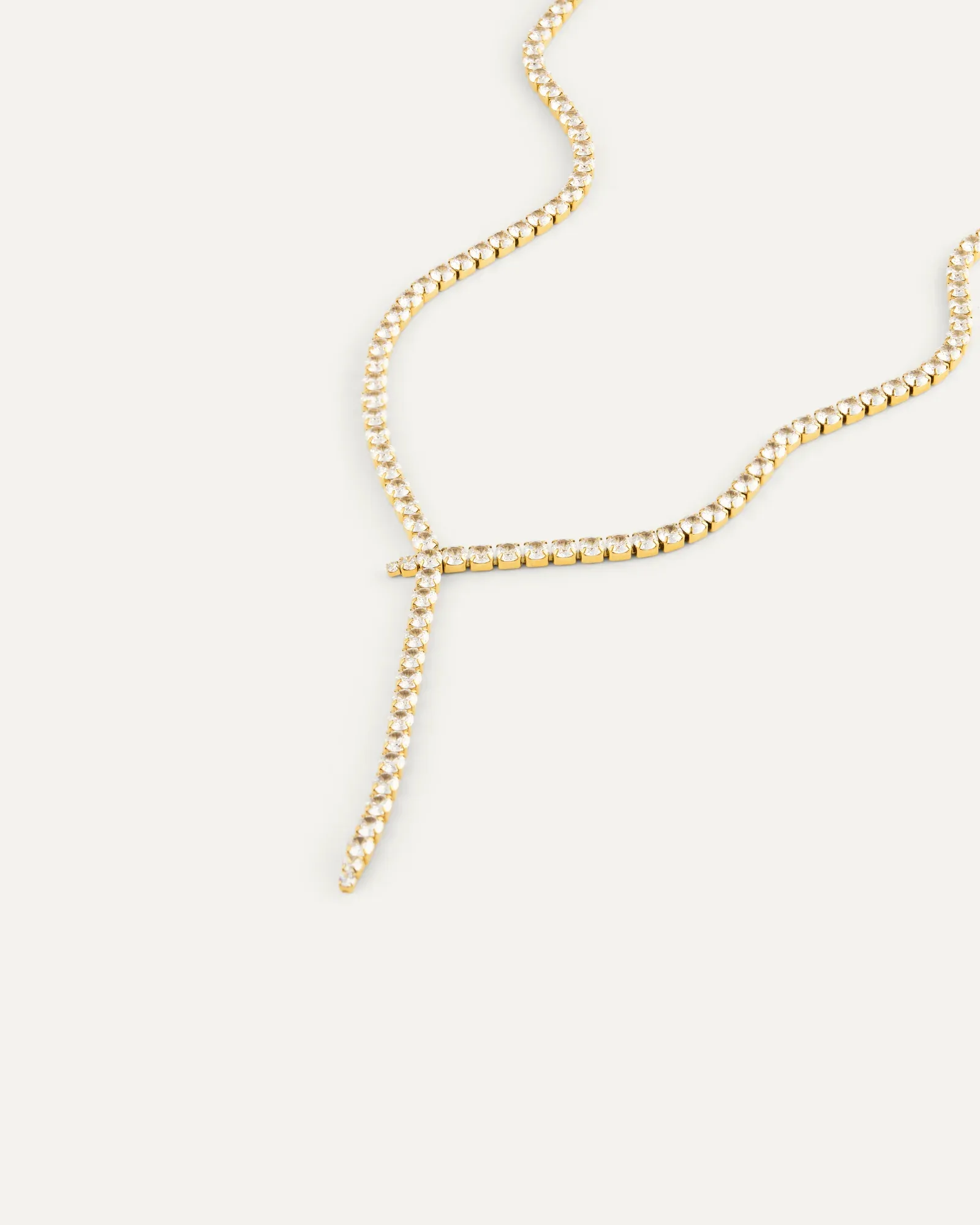 Gold plated steel lariat necklace set with cubic zirconia