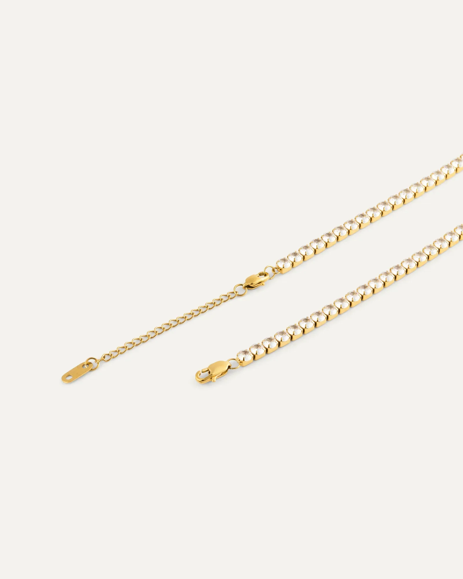 Gold plated steel lariat necklace set with cubic zirconia