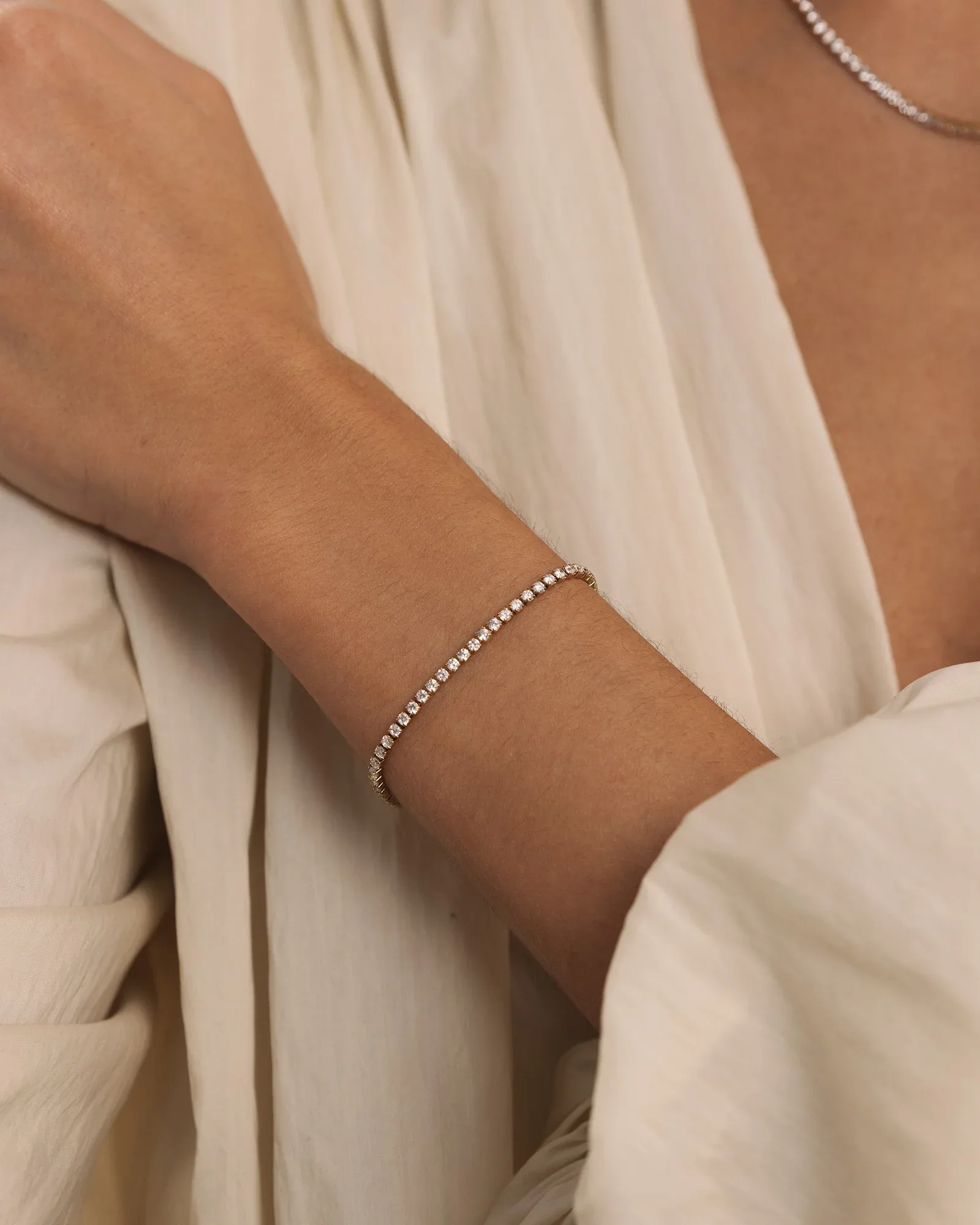 Gold plated steel tennis bracelet set with cubic zirconia