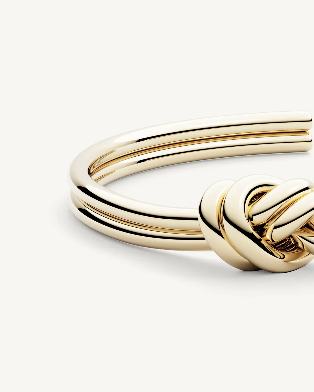 Gold plated steel double knot bangle