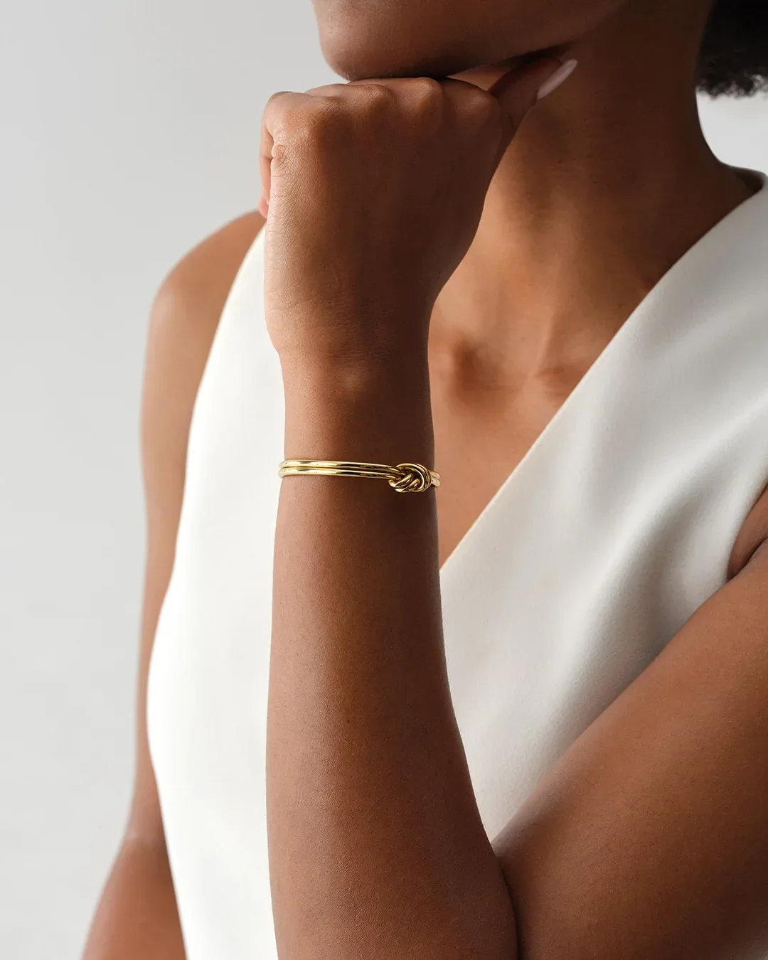 Gold plated steel double knot bangle