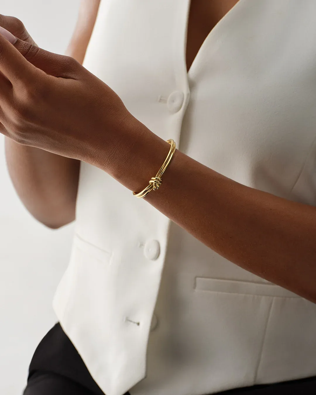 Gold plated steel double knot bangle