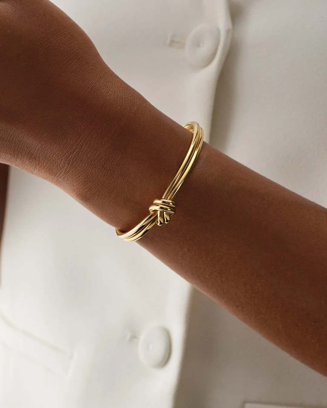 Gold plated steel double knot bangle