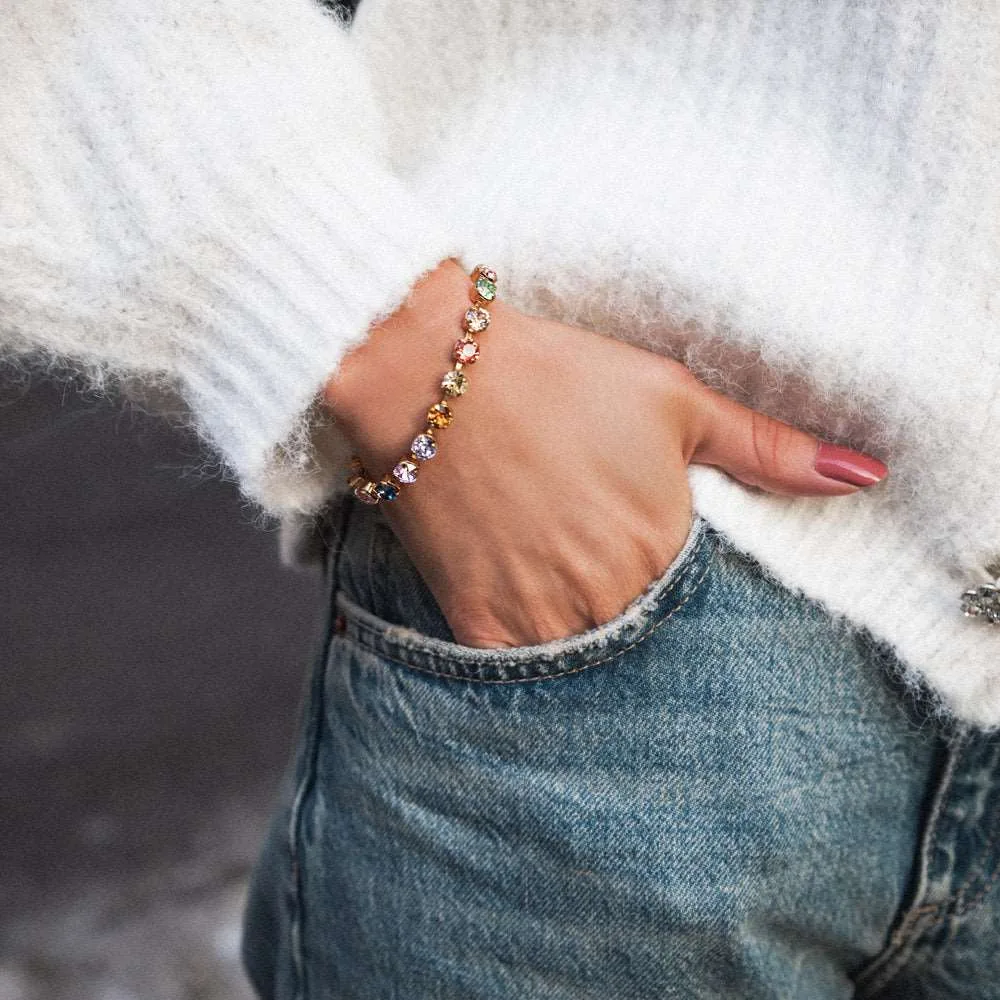 Gold bracelet set with multicoloured crystals