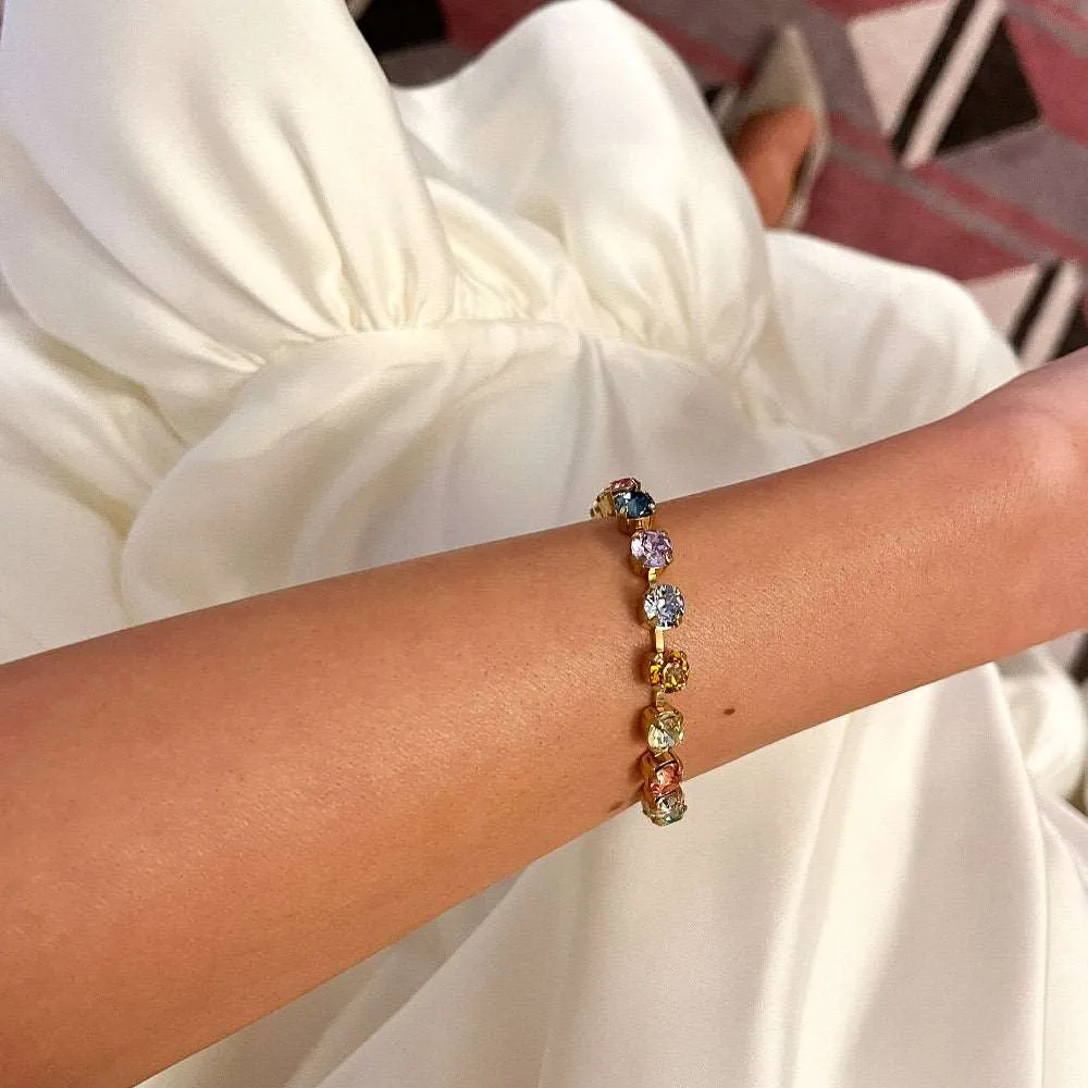 Gold bracelet set with multicoloured crystals