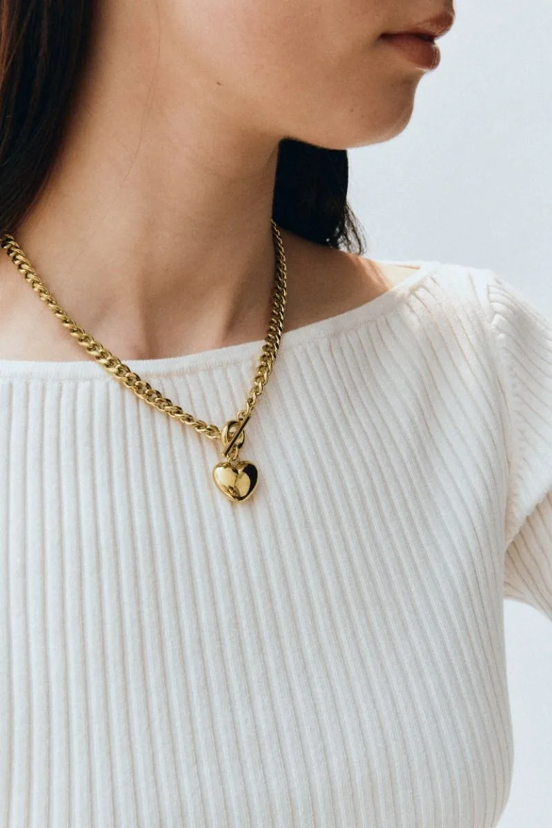Small puffed heart pendant necklace in gold plated stainless steel