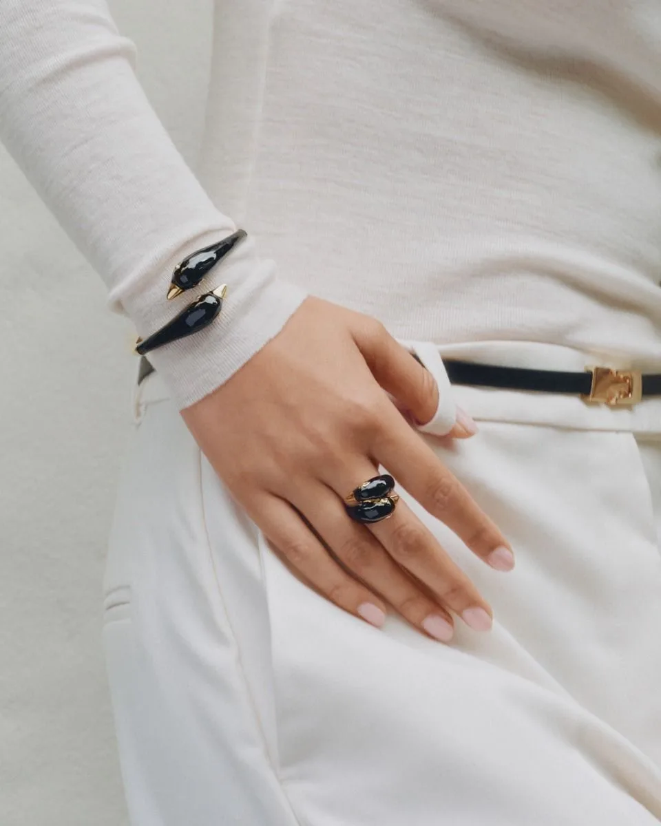 Wide black enamel bangle in gold plated stainless steel