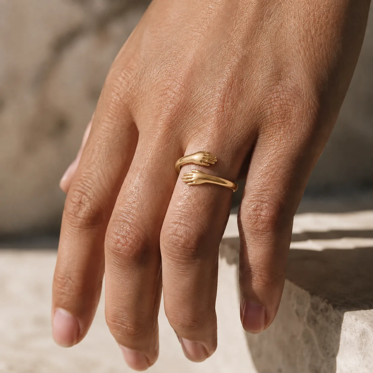 Hug Ring in gold, worn outdoors