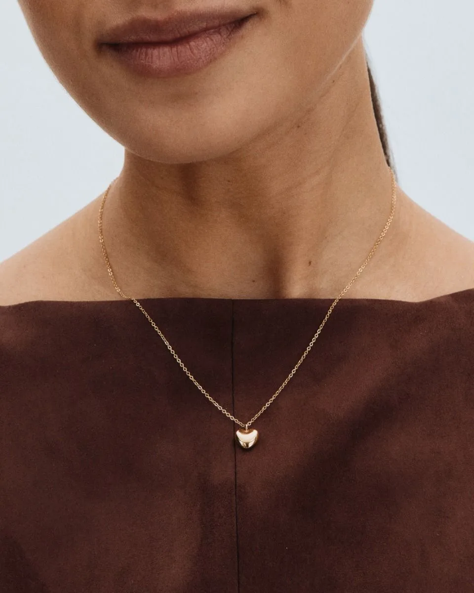 Small puffed heart pendant necklace in gold plated stainless steel