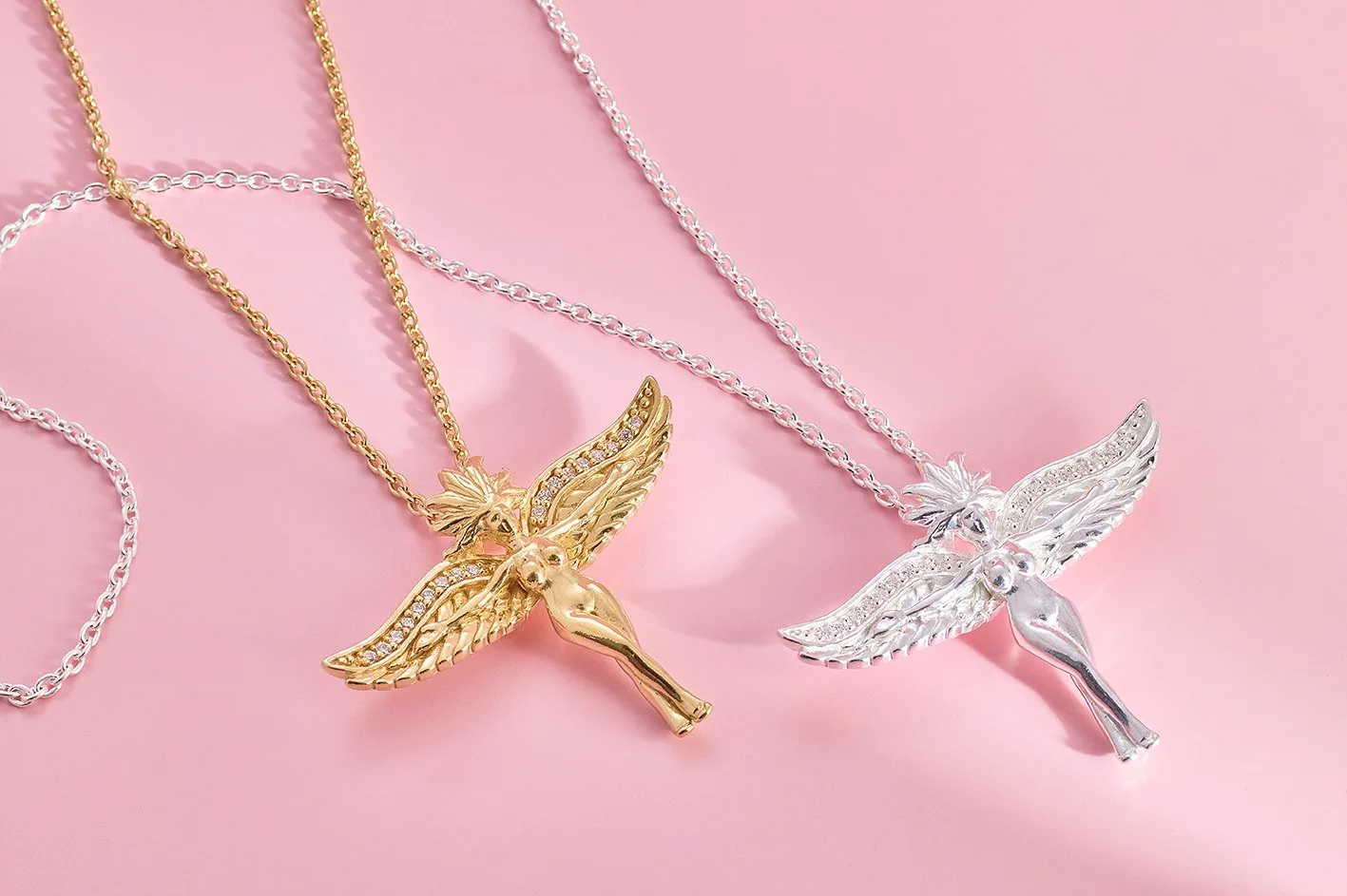 Winged figure pendant in sterling silver on a long chain
